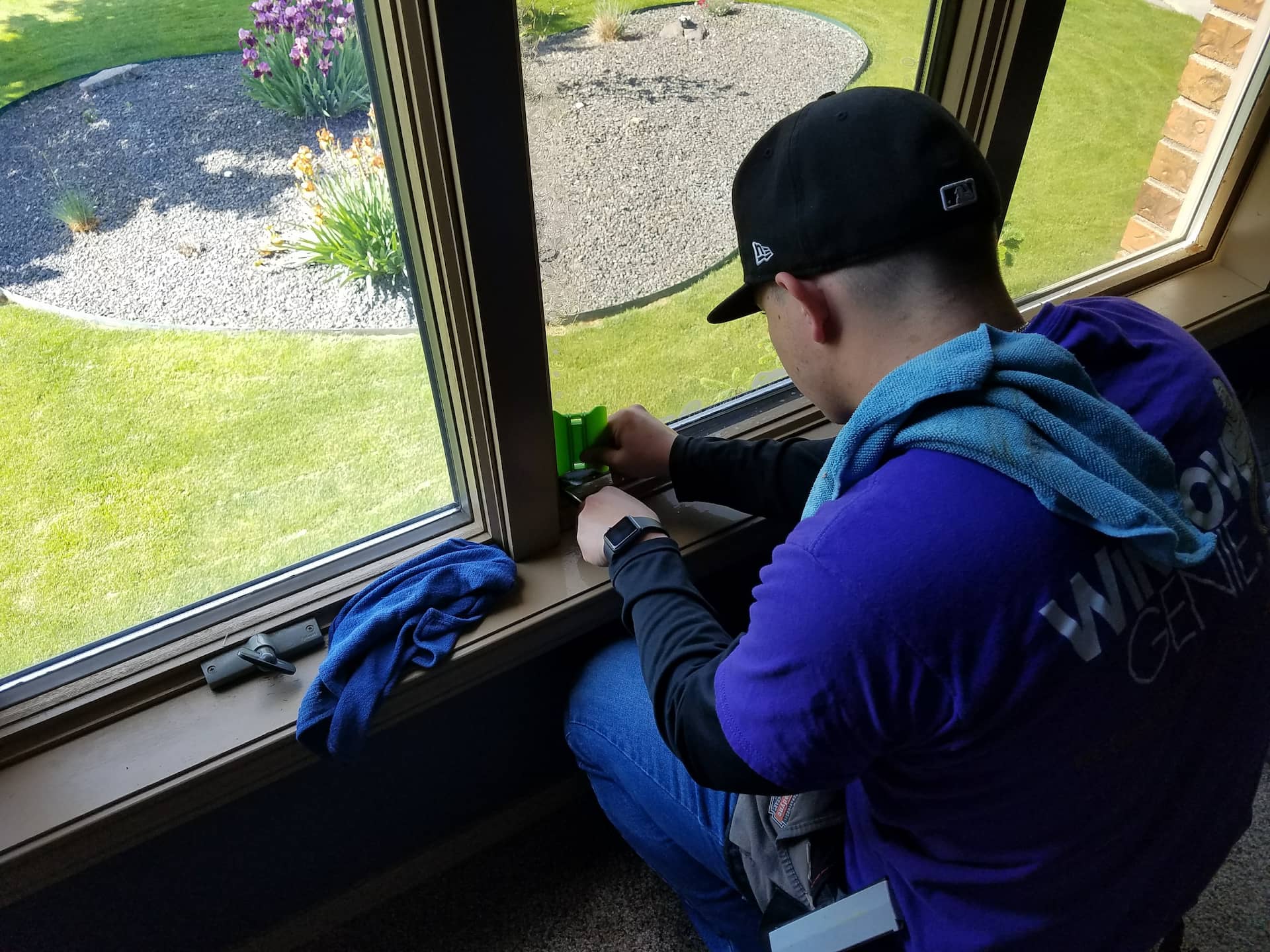 Meridian Window Tint installing a new film on a client's home