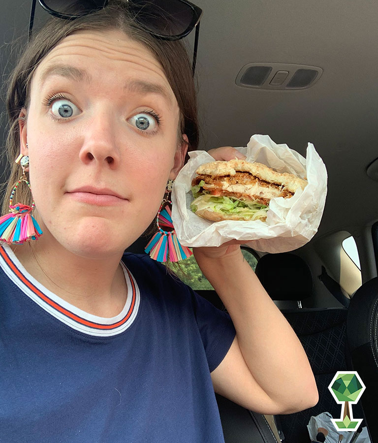 Mariah showing off the size of a Westside Drive-thru burger in Boise, Idaho