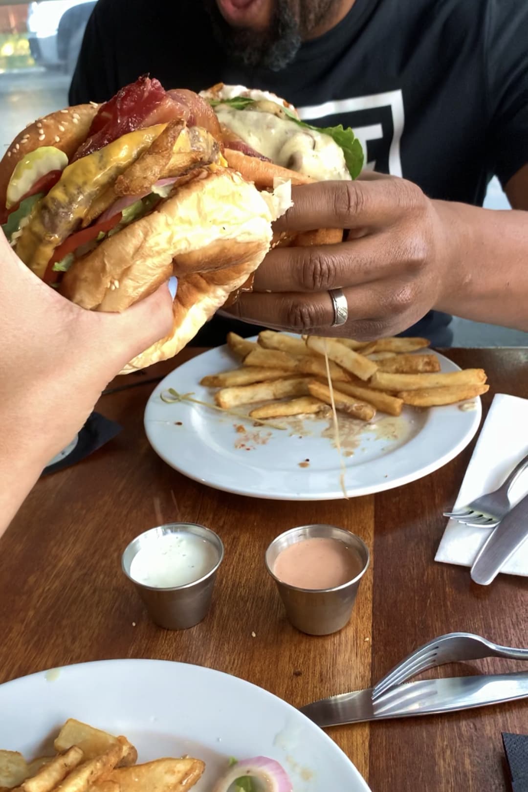 D.J. Lyttle eating a large hamburger