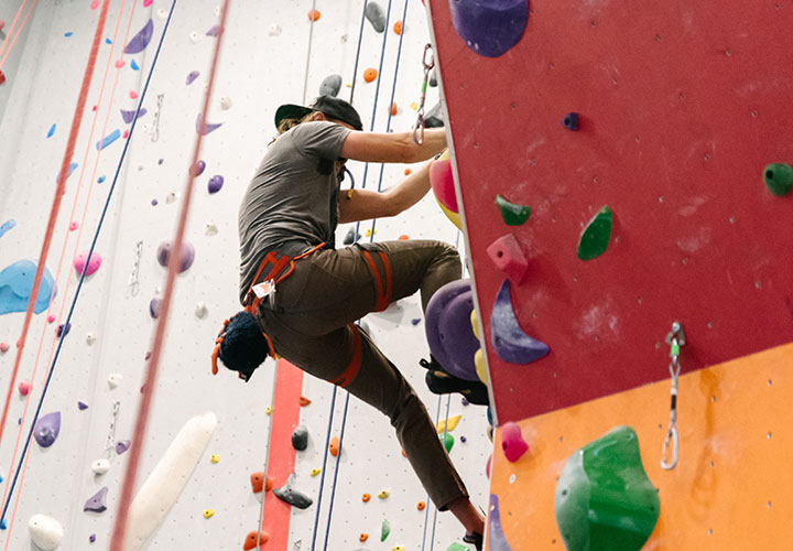 A picture of someone climbing a rock wall