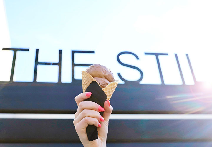 A picture of someone holding an ice cream cone