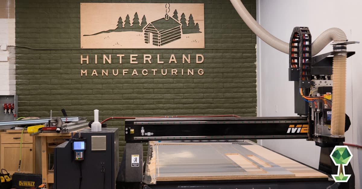 A photo with the Hinterland logo and a CNC machine